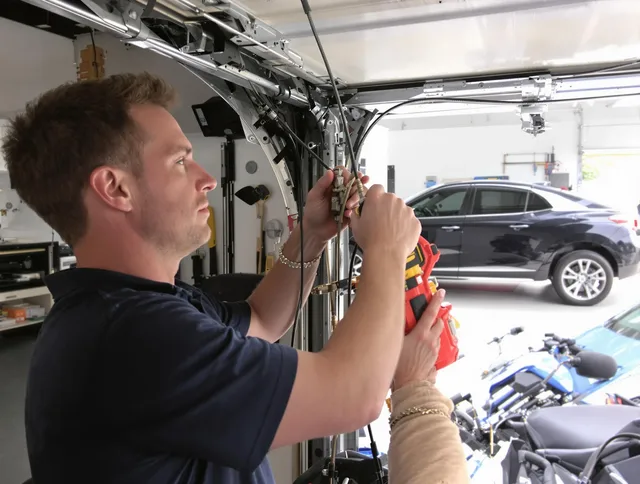 Stow Garage Door Repair safety certified technician performing cable replacement in Stow