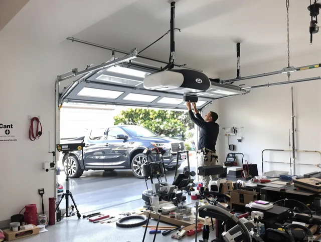 Stow Garage Door Repair specialist installing smart garage door opener system in Stow home