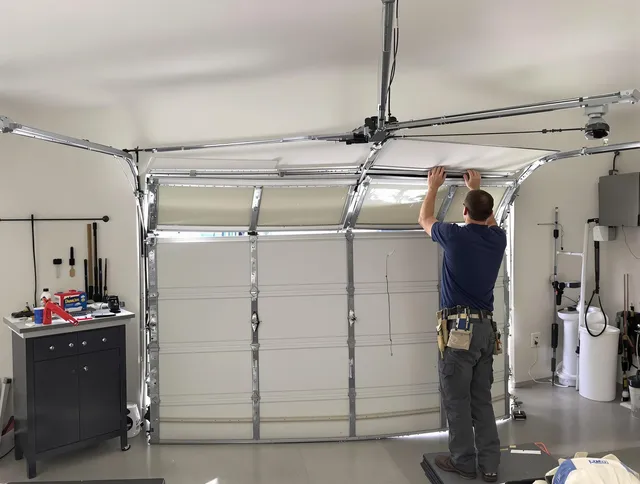 Stow Garage Door Repair specialist performing precise section replacement on Stow garage door